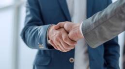 Handshake symbolizing business partnership and distribution collaboration